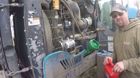 new holland skid steer oil change|new holland l220 oil change video.